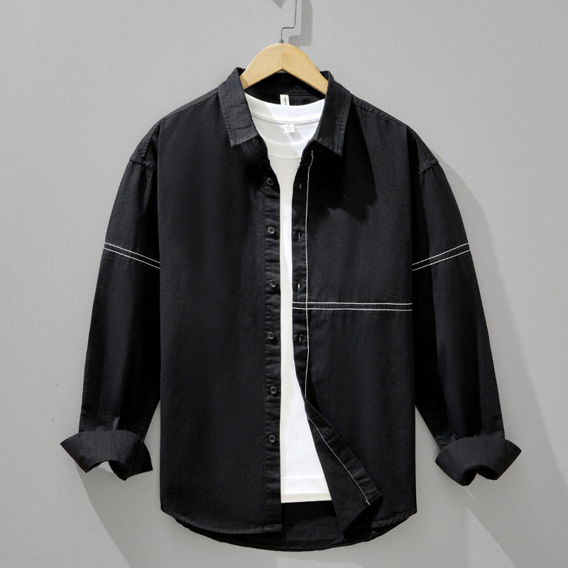 Crisp white men's relaxed fit shirt for versatile everyday wear, ideal for smart casual men's fashion.