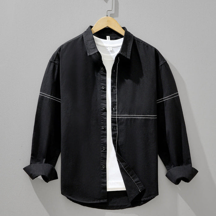 Crisp white men's relaxed fit shirt for versatile everyday wear, ideal for smart casual men's fashion.