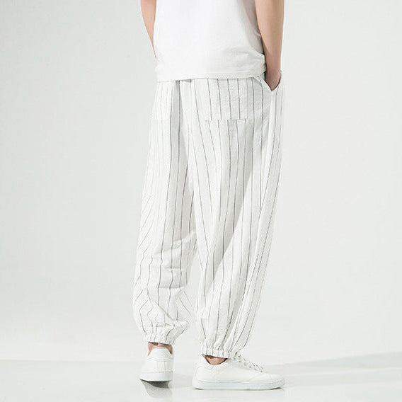 Versatile men's pinstripe joggers, relaxed harem fit, perfect for everyday comfort and casual style.