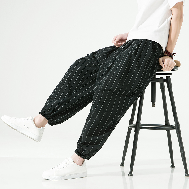 Stylish men's pinstripe harem joggers, relaxed fit, ideal for casual pants & comfortable wear.