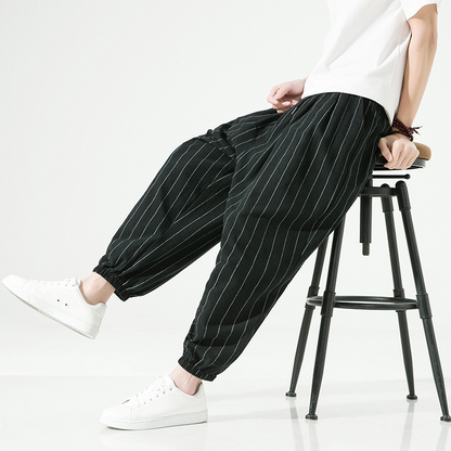 Stylish men's pinstripe harem joggers, relaxed fit, ideal for casual pants & comfortable wear.