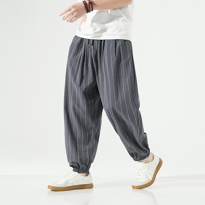 Comfortable men's linen blend joggers with a relaxed harem fit and adjustable drawstring.