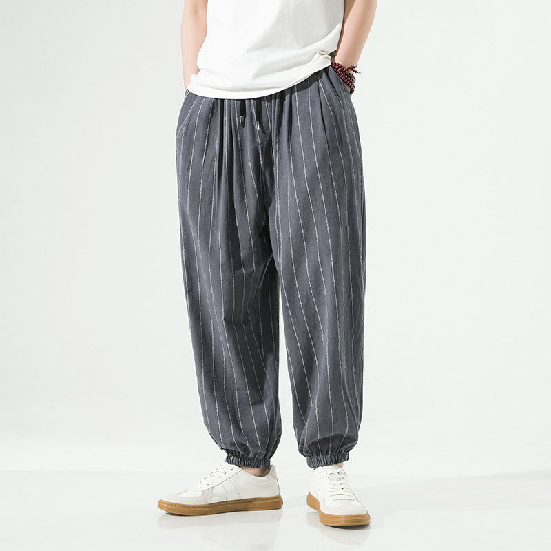 Front view of men's relaxed fit pinstripe harem joggers, perfect casual pants for leisure.