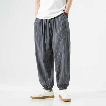 Front view of men's relaxed fit pinstripe harem joggers, perfect casual pants for leisure.