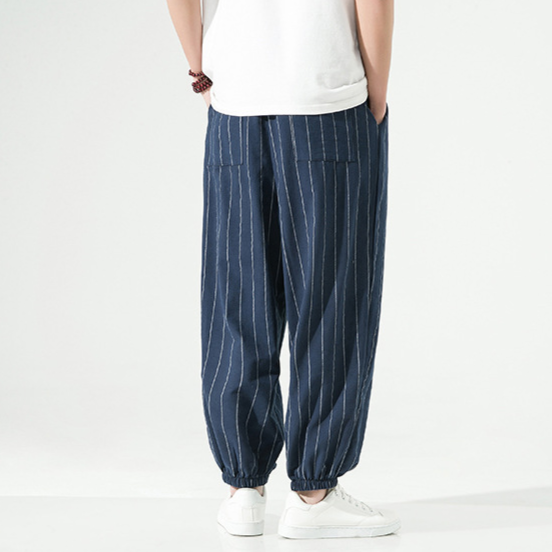 Detail shot of fabric texture on men's linen blend relaxed fit harem joggers, showing quality.