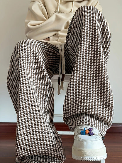 Men's relaxed fit herringbone lounge pants with drawstring waist for ultimate comfort and casual style.