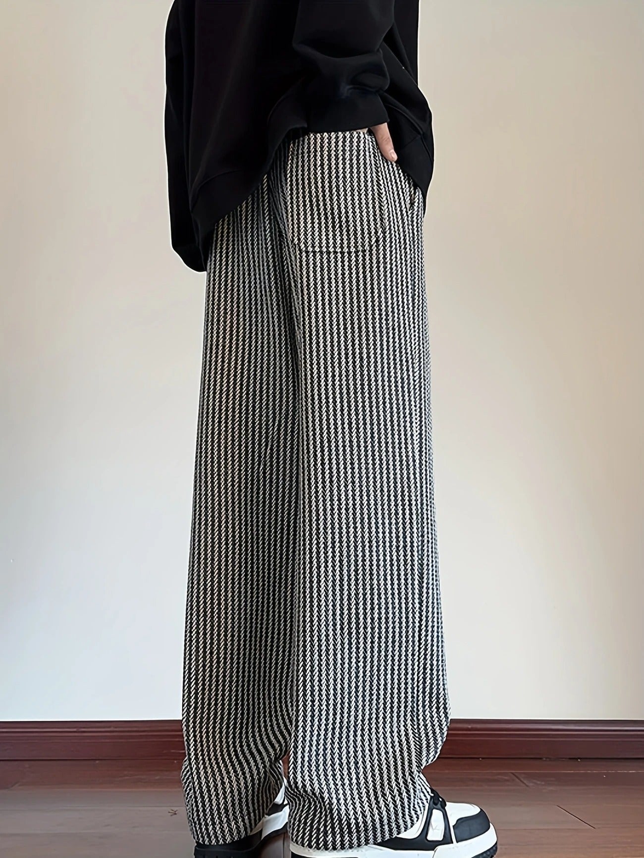 Men's apparel: relaxed fit herringbone casual lounge pants, designed for comfort and modern style.