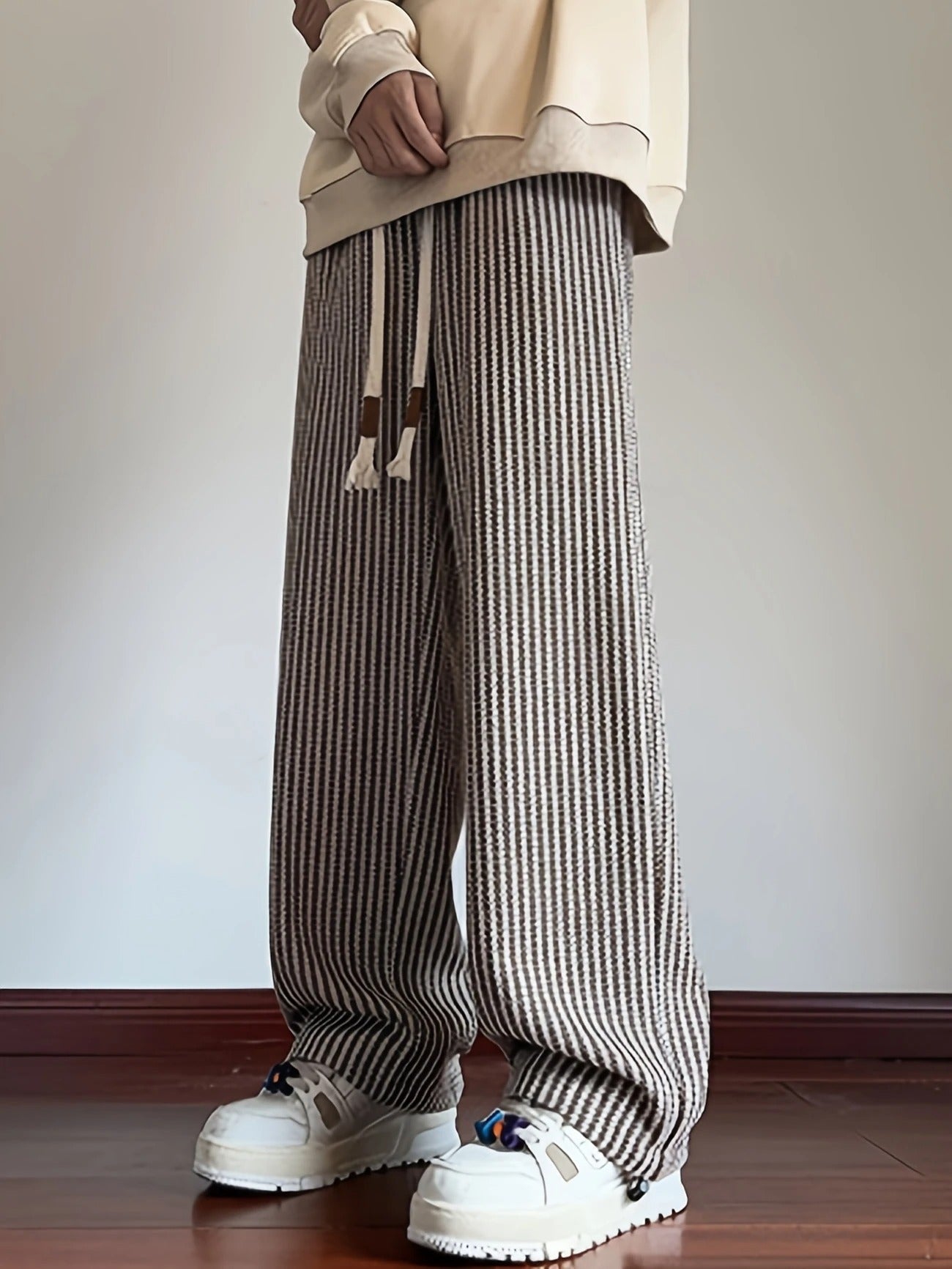 Relaxed fit men's casual pants with a distinctive herringbone design; comfortable for everyday lounging.