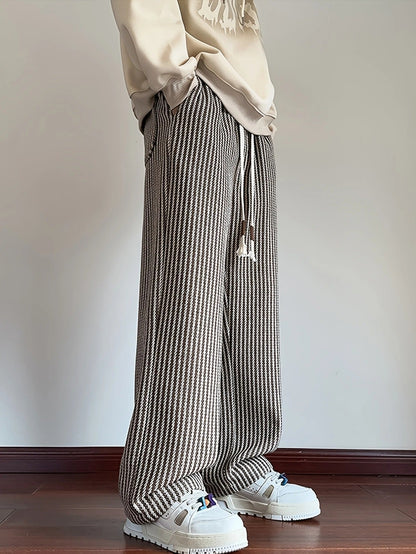 Stylish men's herringbone pattern lounge pants, relaxed fit and comfortable for modern streetwear fashion.
