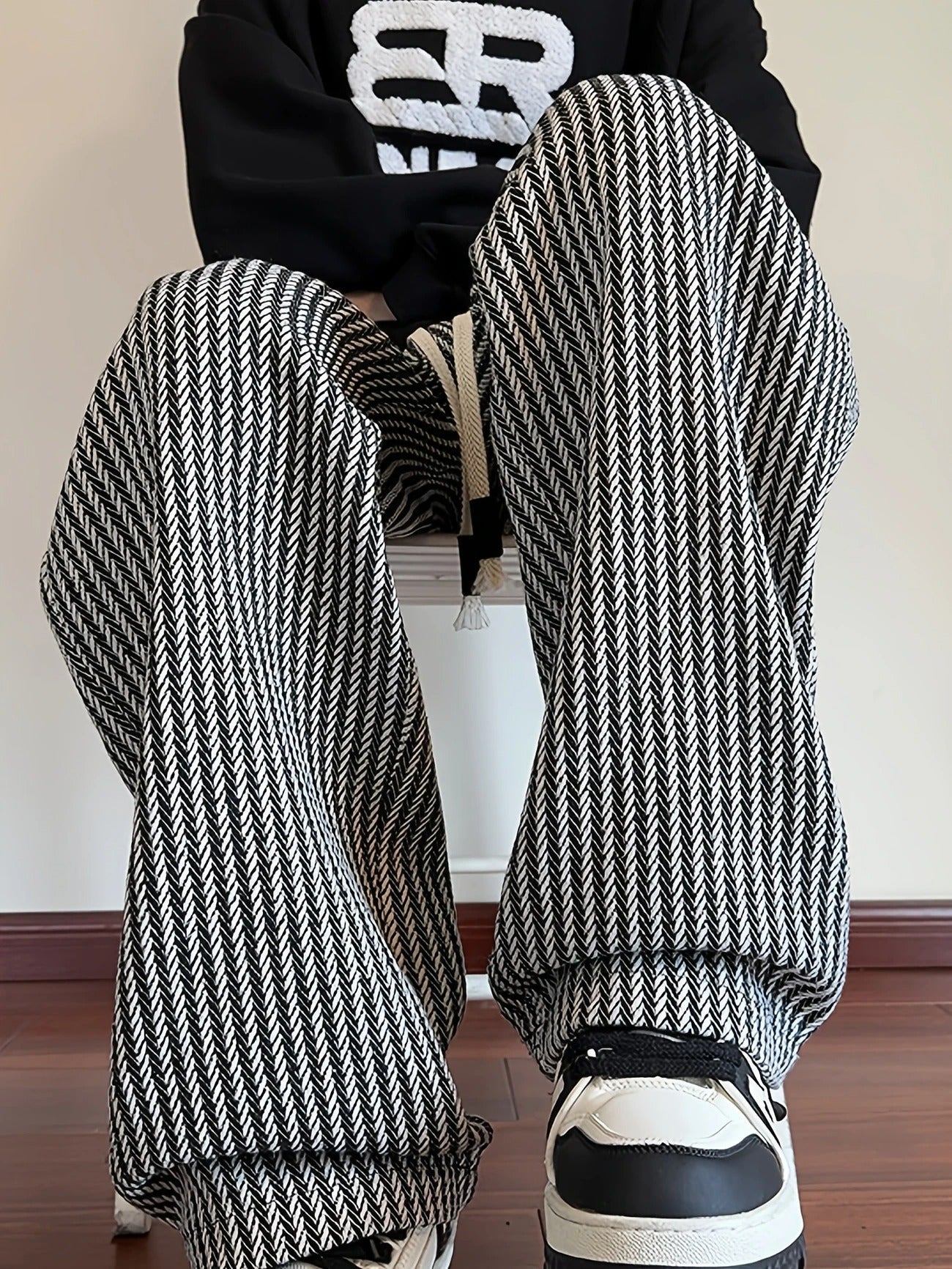 Brown men's relaxed fit pants, herringbone design with drawstring for adjustable comfort and relaxed fit.