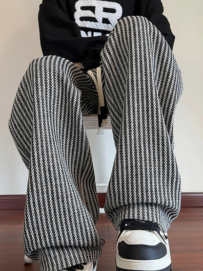 Brown men's relaxed fit pants, herringbone design with drawstring for adjustable comfort and relaxed fit.