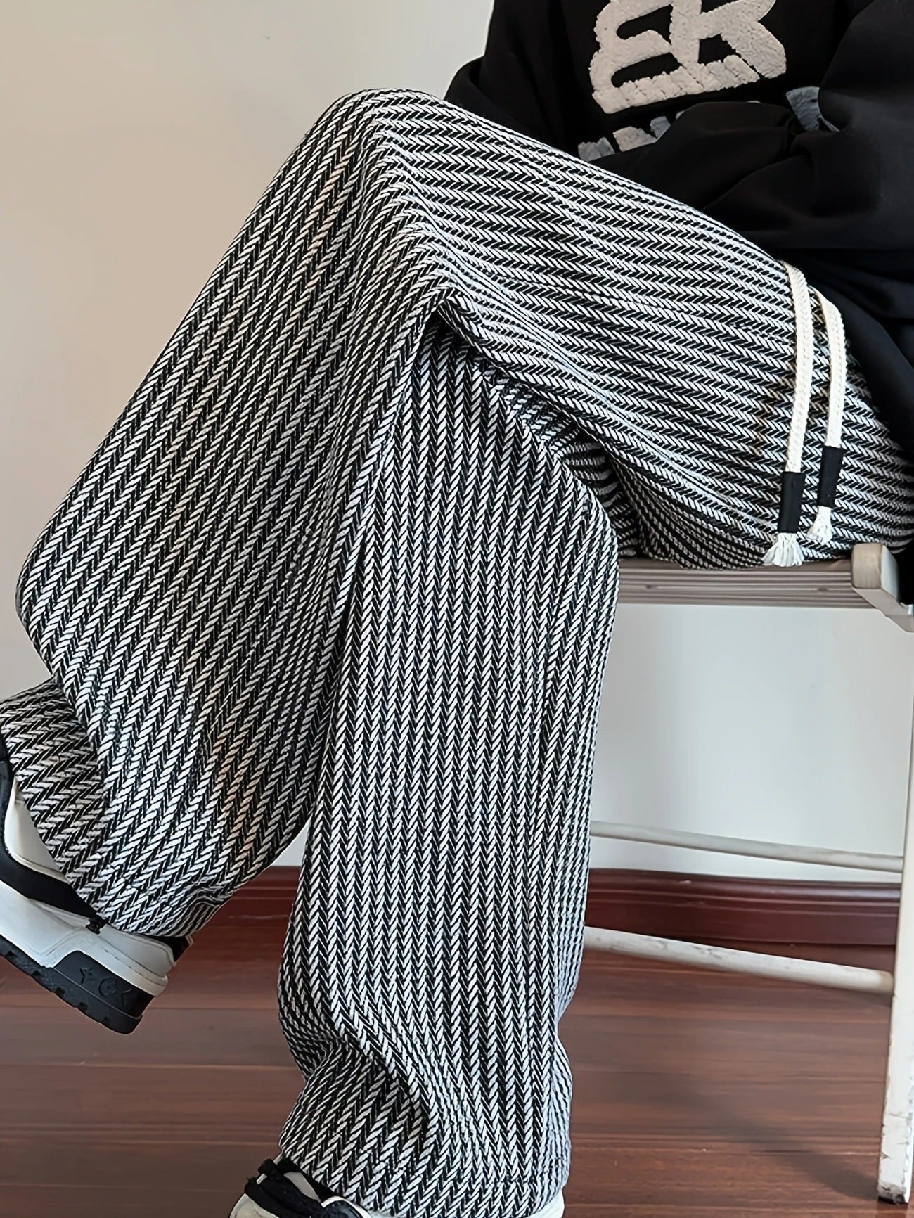 Black men's casual relaxed fit lounge pants, showcasing an elegant herringbone pattern for everyday wear.