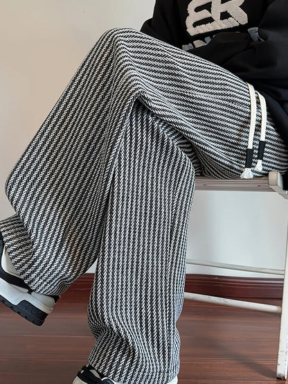 Black men's casual relaxed fit lounge pants, showcasing an elegant herringbone pattern for everyday wear.