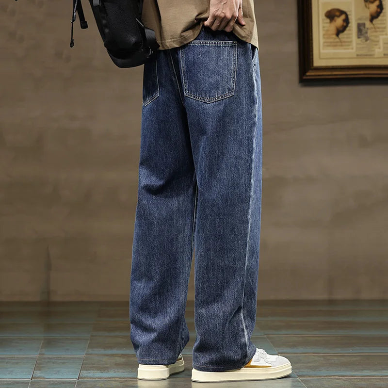 Ash grey men's relaxed fit denim joggers featuring a comfortable drawstring waist and wide leg design.