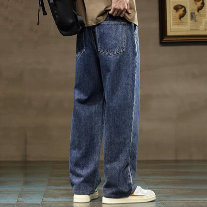 Ash grey men's relaxed fit denim joggers featuring a comfortable drawstring waist and wide leg design.