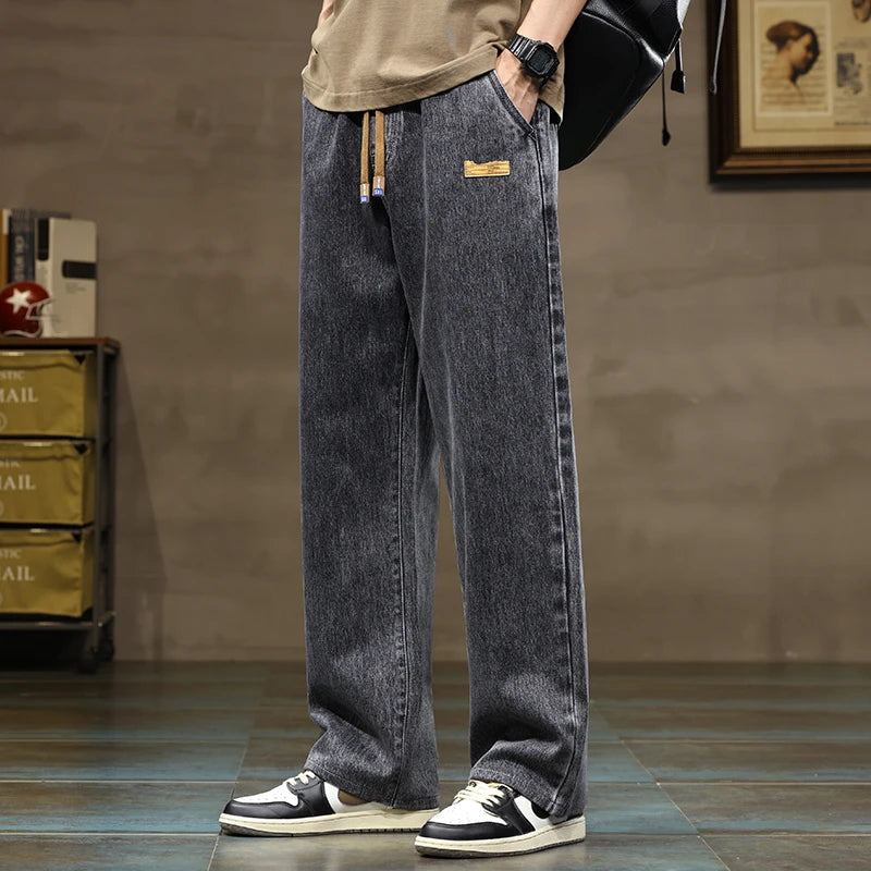 Modern men's casual pants: relaxed fit denim joggers in sky blue with practical drawstring.
