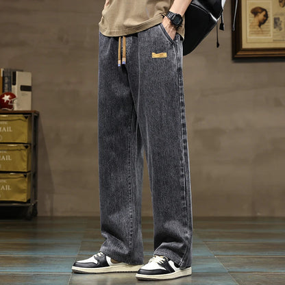 Modern men's casual pants: relaxed fit denim joggers in sky blue with practical drawstring.