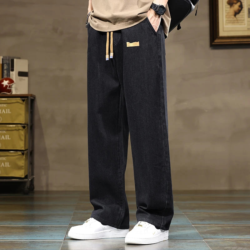 Ash grey relaxed fit denim joggers for men, offering stylish comfort for any casual setting.