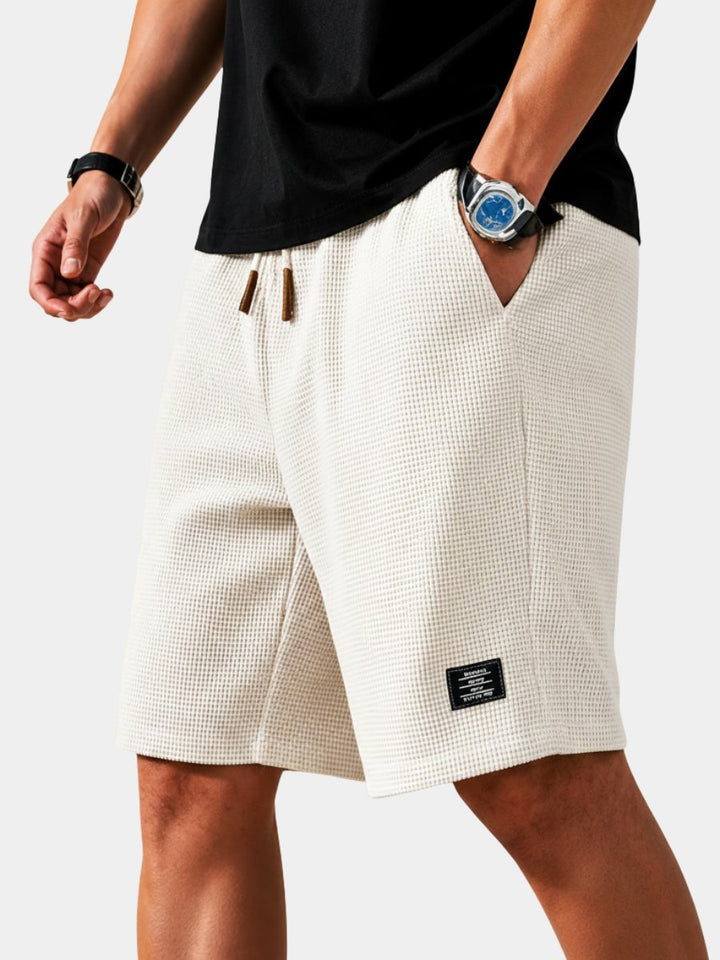 Men's relaxed fit lightweight summer shorts with drawstring for ultimate comfort.