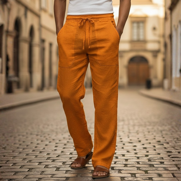 Breathable men's relaxed fit linen trousers, featuring a comfortable drawstring waist for summer.