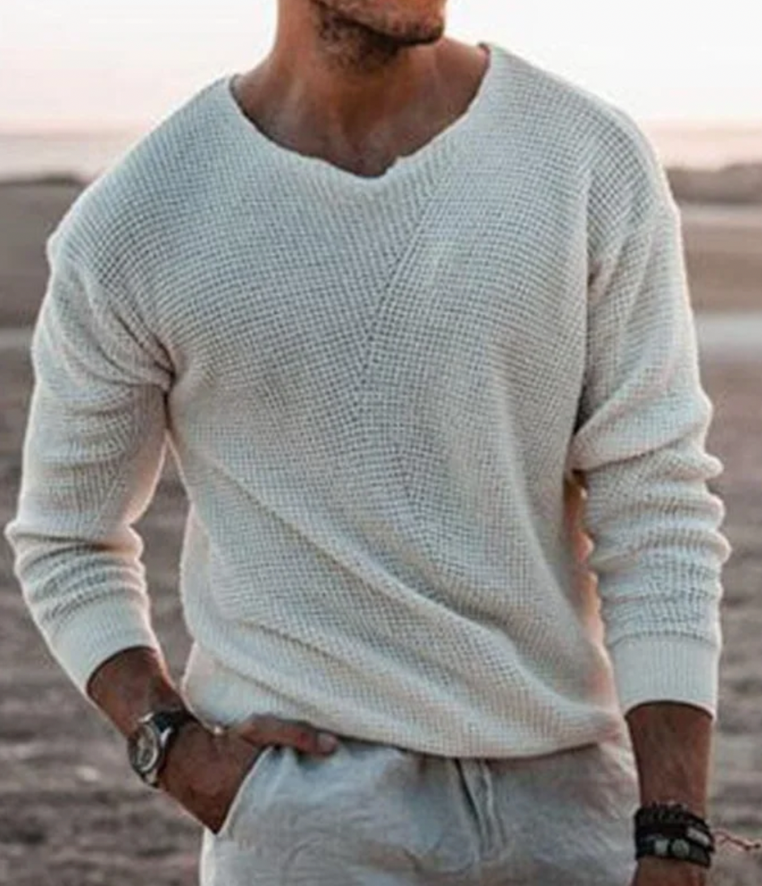 Men's versatile V-neck jumper, relaxed fit, long sleeves. Ideal for layering in cool weather fashion.