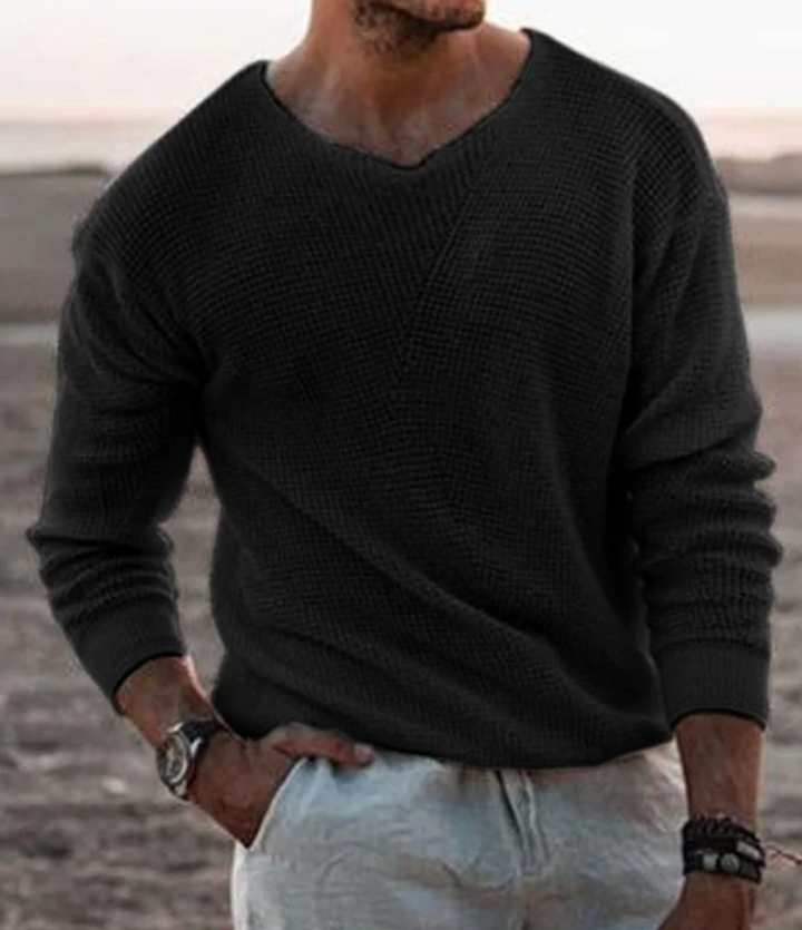 Cozy men's long-sleeve V-neck sweater, relaxed fit. Essential winter clothing for casual comfort.