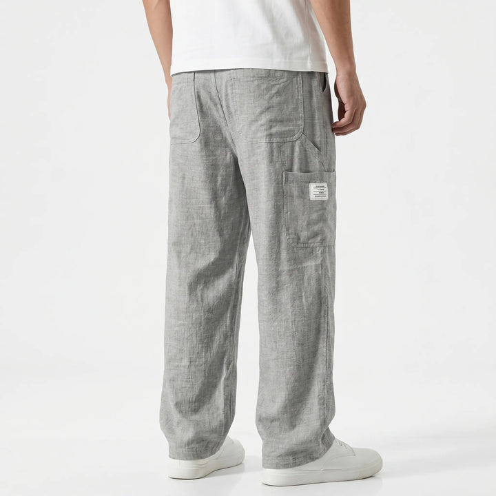 Men's casual cargo pants, relaxed loose fit, straight leg with practical pockets. Drawstring waist for comfort.