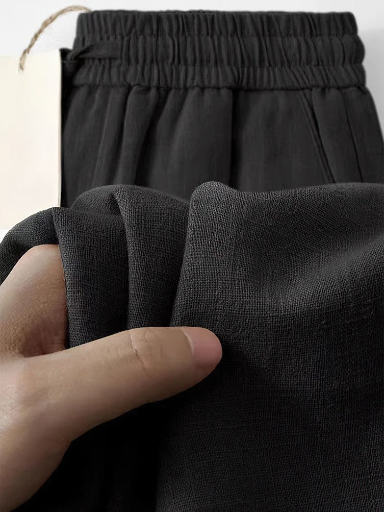 Man wearing comfortable men's relaxed fit lounge pants with drawstring, perfect for stylish everyday wear.