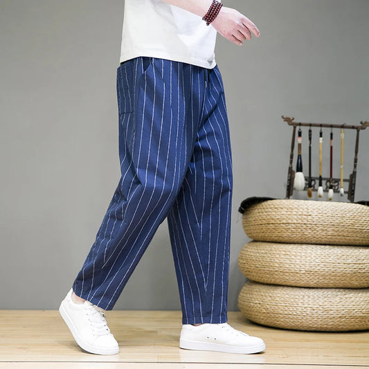 Men's relaxed fit pinstripe lounge pants with drawstring. Comfortable wide leg casual everyday wear.