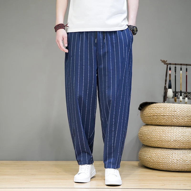 Close-up of men's stylish pinstripe lounge pants fabric. Relaxed fit, soft, perfect for casual wear.