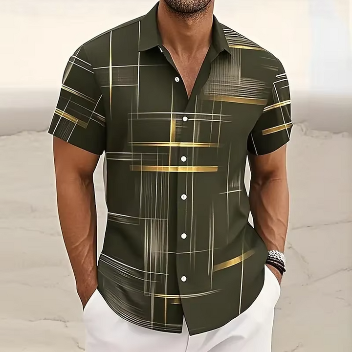 Close-up of a men's geometric print polo shirt, showcasing its button front and soft fabric. Relaxed fit.