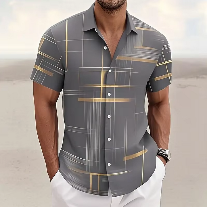 Modern men's polo shirt with an eye-catching geometric print, offering a relaxed fit for casual fashion.