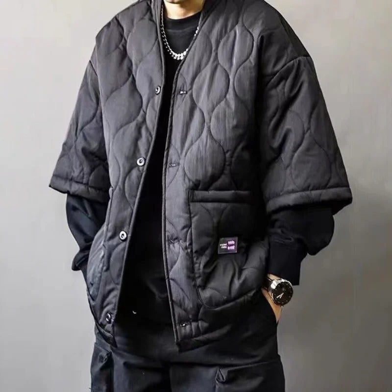 Men's relaxed fit quilted bomber jacket in black, ideal for urban streetwear & casual fall/spring outerwear.