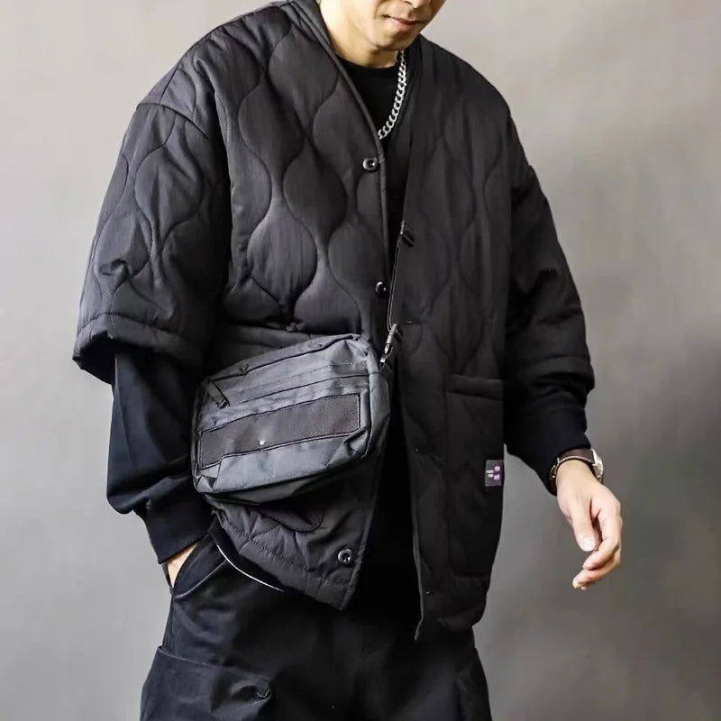 Stylish men's oversized quilted bomber jacket with buttons, perfect for modern urban style and utility fashion.