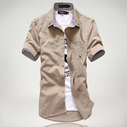 Comfortable men's relaxed fit short sleeve button-up shirt, made from lightweight, breathable cotton.
