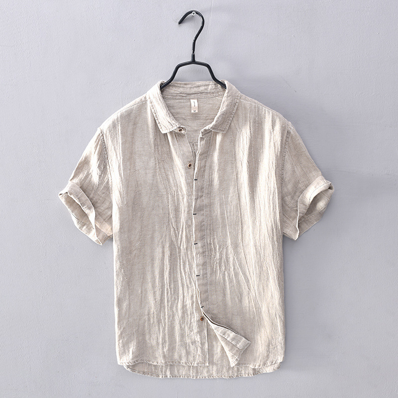 Men's vacation wear short-sleeve button-down, relaxed fit, breathable for summer travel.