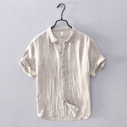 Men's vacation wear short-sleeve button-down, relaxed fit, breathable for summer travel.