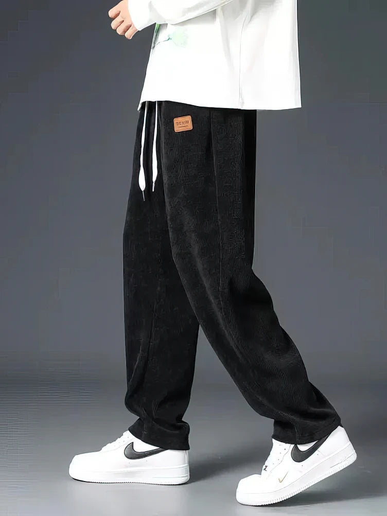 Men's relaxed fit straight-leg everyday pants with elastic waist & drawstring, perfect for comfortable casual wear.