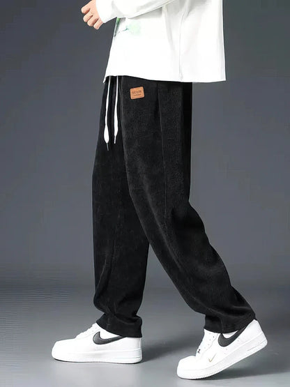 Men's relaxed fit straight-leg everyday pants with elastic waist & drawstring, perfect for comfortable casual wear.