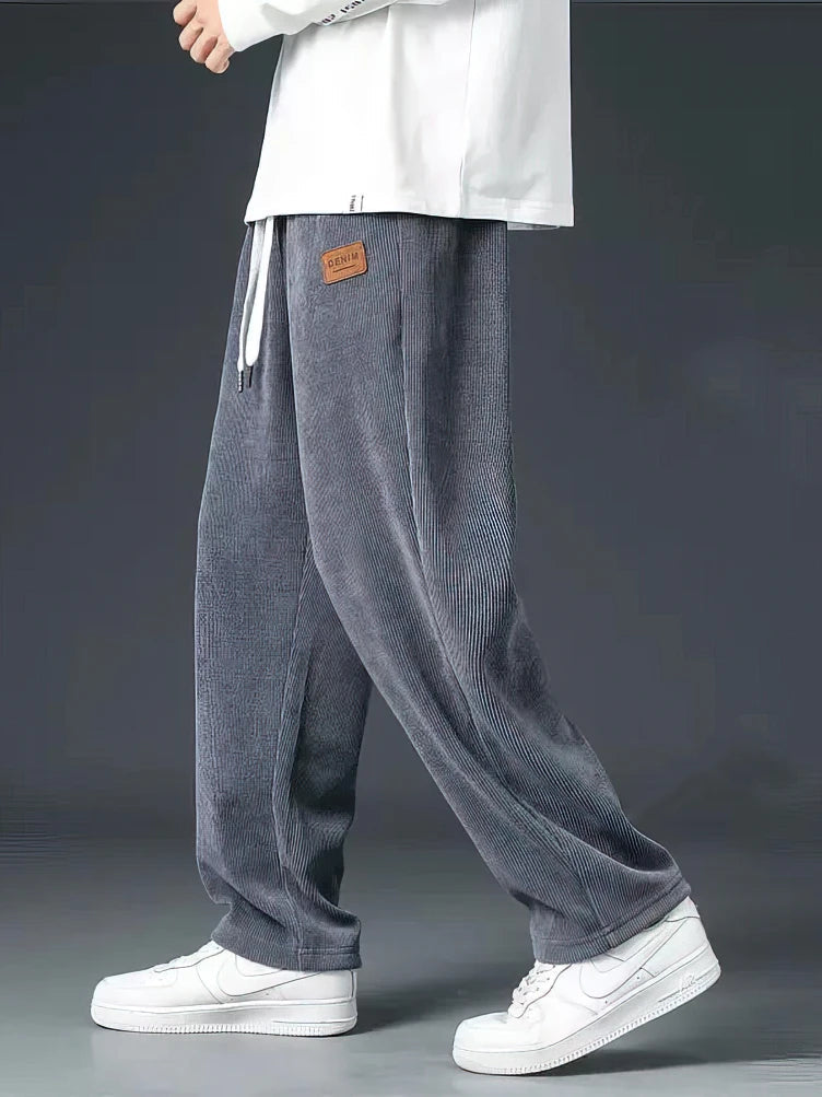 Stylish black men's relaxed straight-leg pants, versatile for everyday fashion & comfortable casual wear.