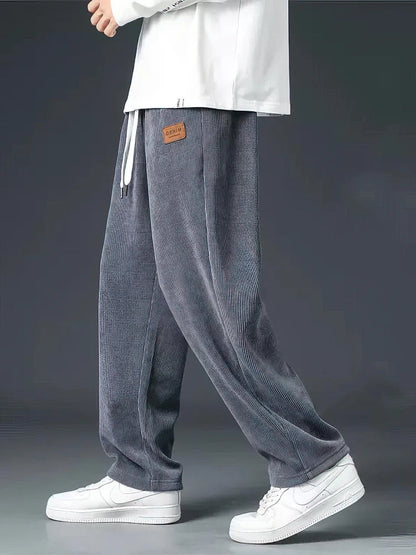 Stylish black men's relaxed straight-leg pants, versatile for everyday fashion & comfortable casual wear.