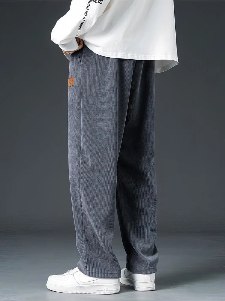 Comfortable grey men's casual straight-leg pants with drawstring and elastic waist for relaxed everyday wear.