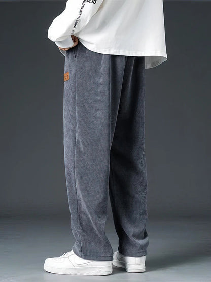 Comfortable grey men's casual straight-leg pants with drawstring and elastic waist for relaxed everyday wear.