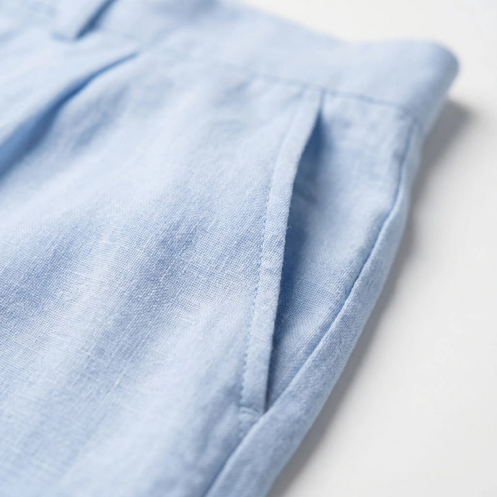 Stylish man wearing relaxed straight leg pants with a casual t-shirt, ideal for spring & summer comfort.