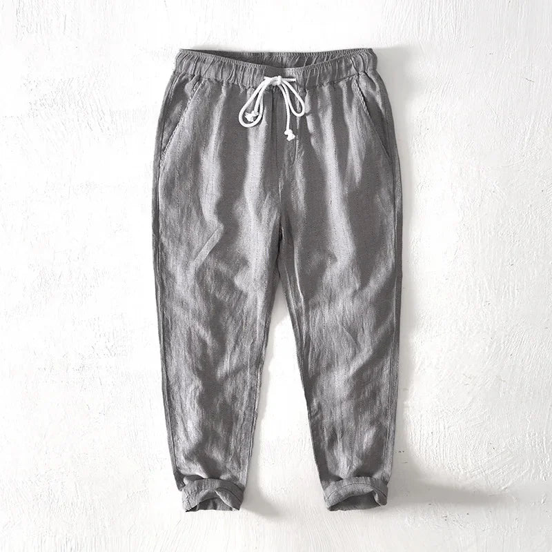 Comfortable men's navy striped pants with a relaxed fit & drawstring, ideal for summer wear & casual fashion.