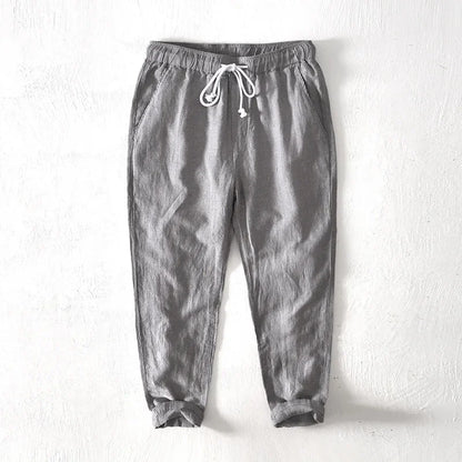 Comfortable men's navy striped pants with a relaxed fit & drawstring, ideal for summer wear & casual fashion.