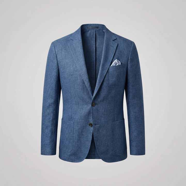 Man models a relaxed fit summer blazer jacket, showcasing a smart casual & comfortable look.