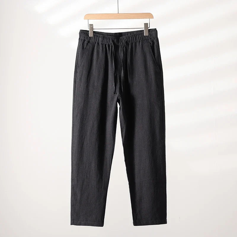 Man wearing versatile relaxed fit summer casual pants, perfect for warm weather activities & daily wear.