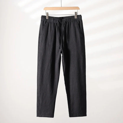 Man wearing versatile relaxed fit summer casual pants, perfect for warm weather activities & daily wear.
