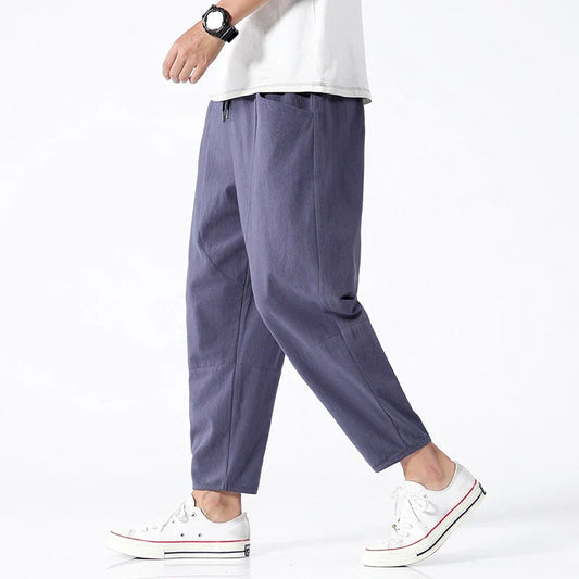 Men's relaxed fit tapered cropped pants in a modern style, ideal for casual everyday wear.